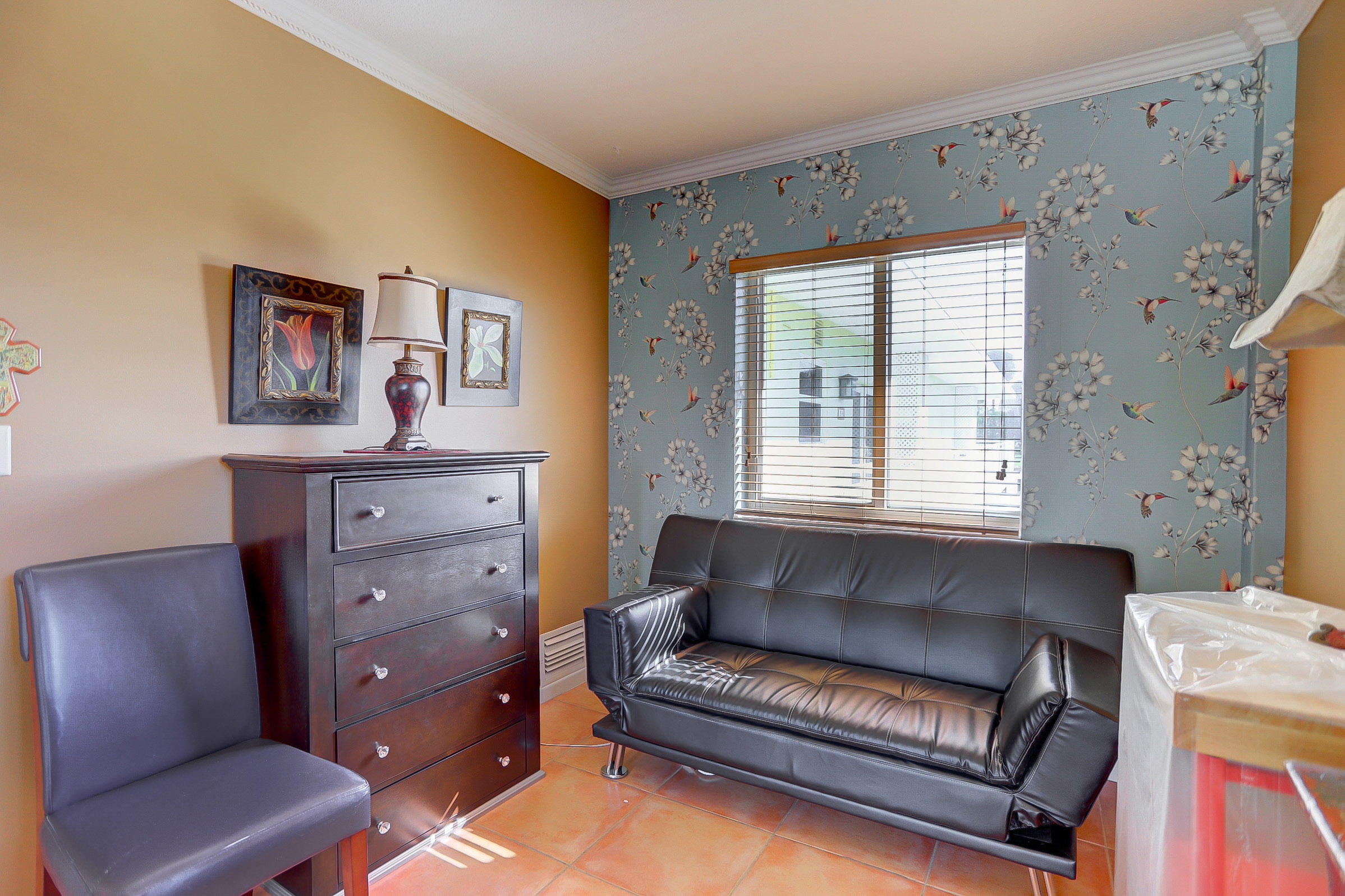 6520 North Ocean Boulevard, Unit 28 Ocean Ridge, FL 33435 - Photo 15 of 32 a living room with furniture and a window