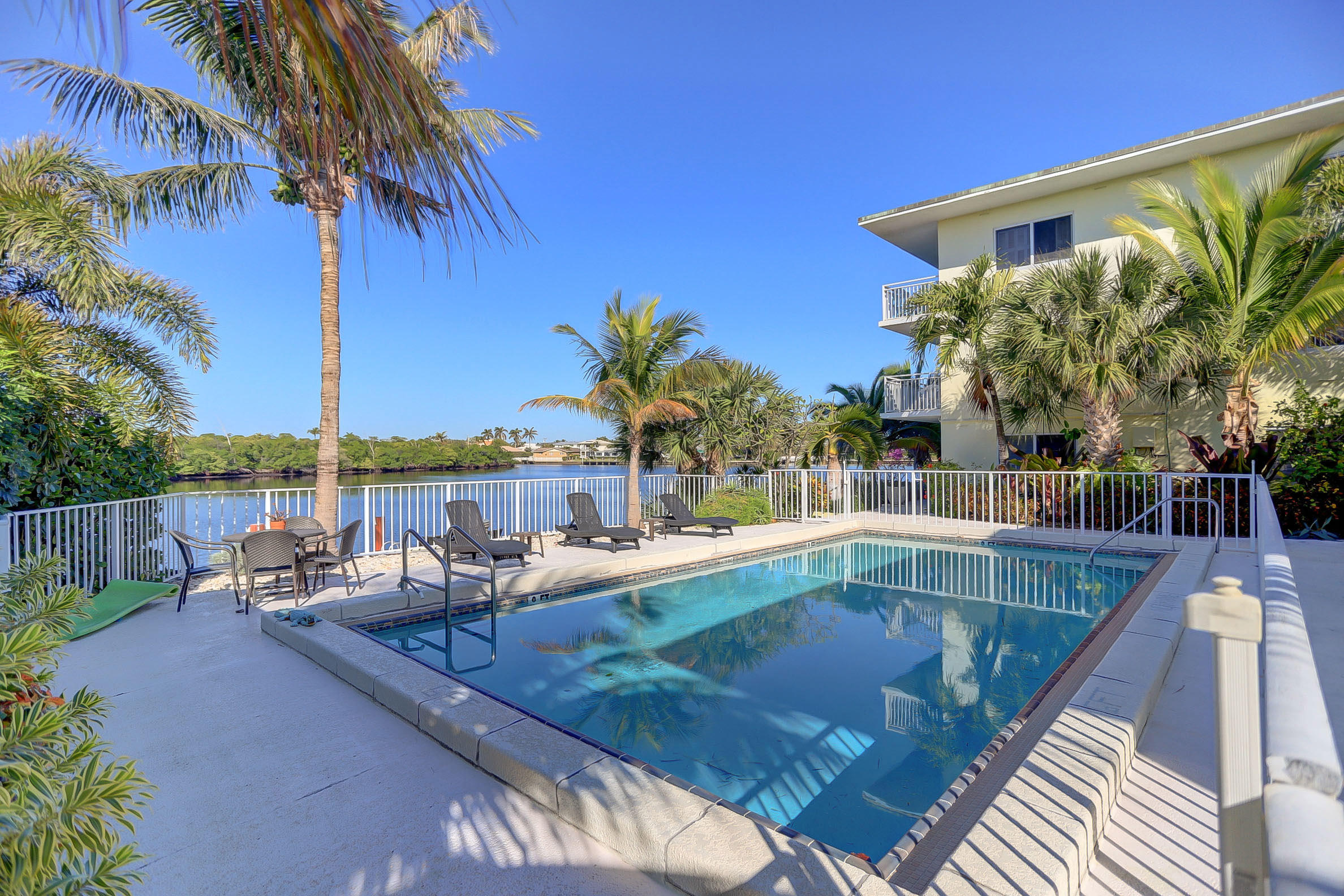 6520 North Ocean Boulevard, Unit 28 Ocean Ridge, FL 33435 - Photo 20 of 32 a view of swimming pool with chairs