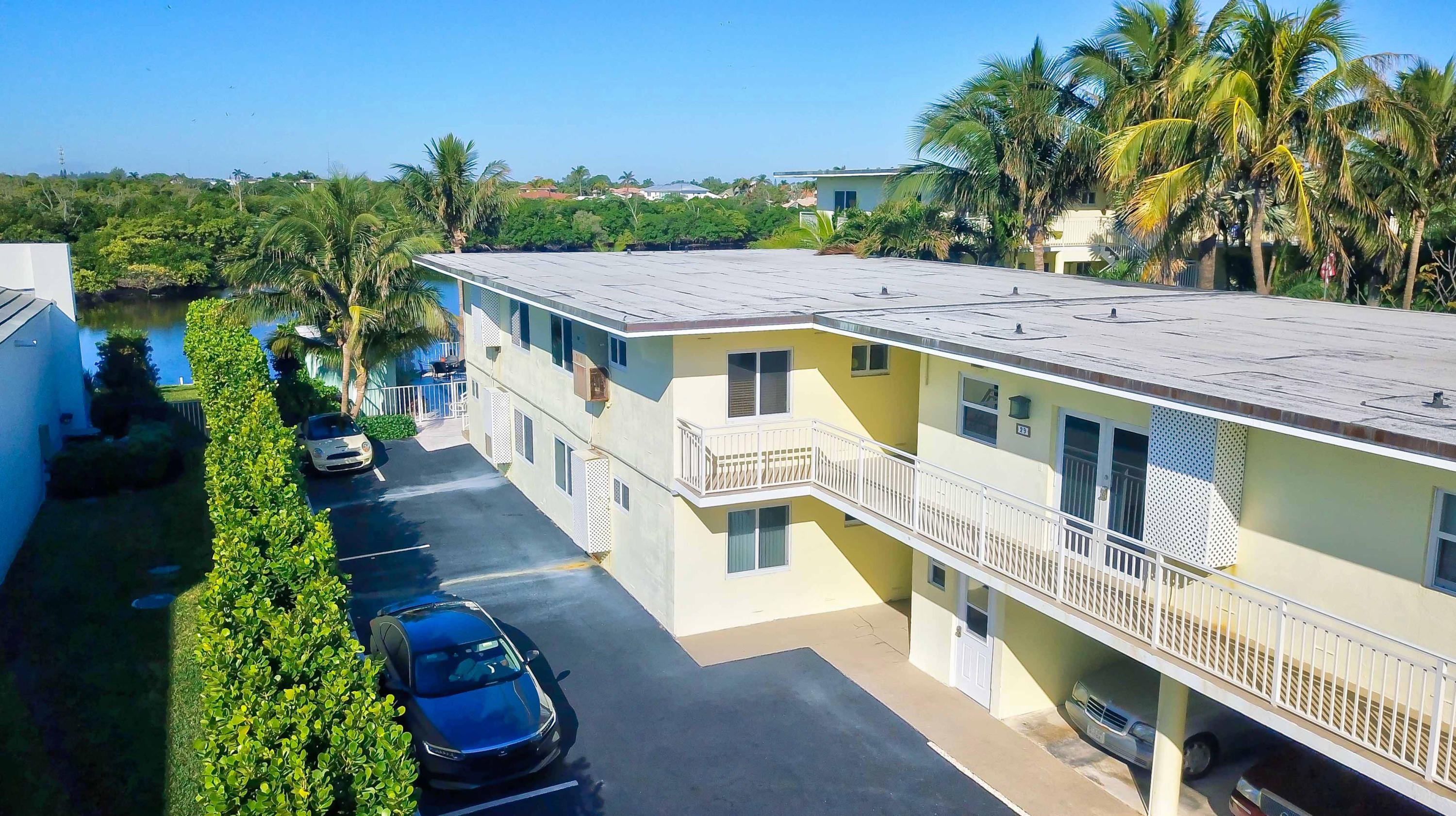 6520 North Ocean Boulevard, Unit 28 Ocean Ridge, FL 33435 - Photo 23 of 32 a view of a house with a yard