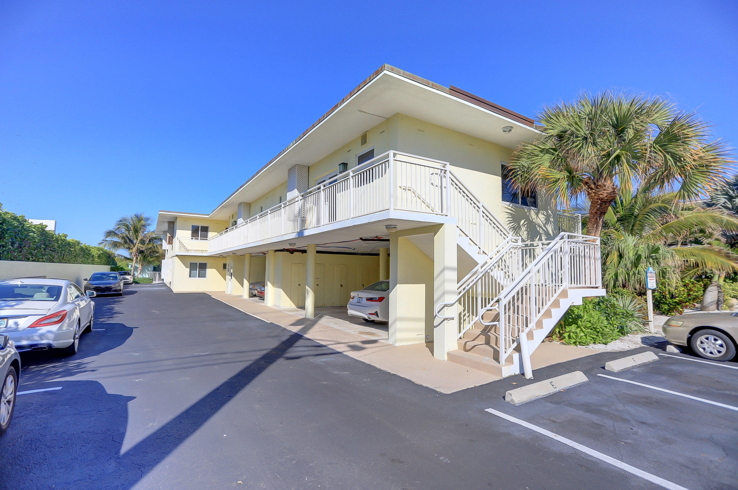 6520 North Ocean Boulevard, Unit 28 Ocean Ridge, FL 33435 - Photo 3 of 32 a view of a car park in front of a building