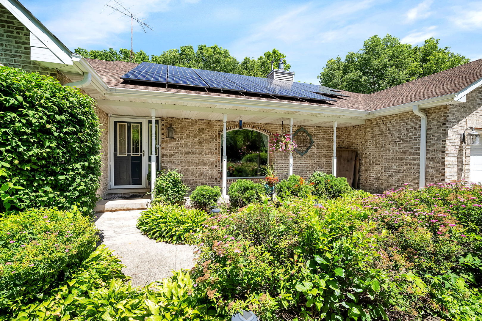 24700 West Canal Road Channahon, IL 60410 - Photo 3 of 30 front view of a house with potted plants