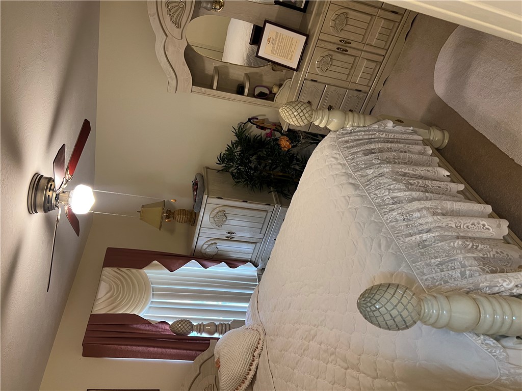 521 Calhoun Shores Parkway Calhoun Falls, SC 29628 - Photo 20 of 39 This cozy bedroom features comfortable carpeting and ample natural light, creating a serene personal retreat.