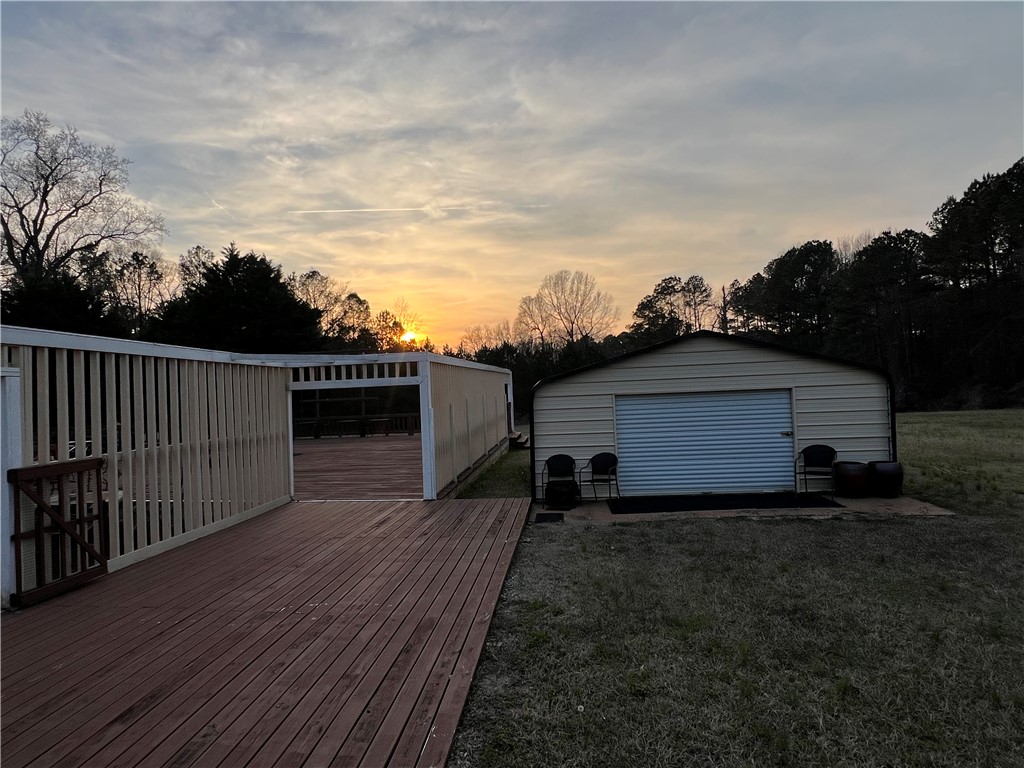 521 Calhoun Shores Parkway Calhoun Falls, SC 29628 - Photo 29 of 39 This spacious yard features a versatile storage building and a generous wooden deck.