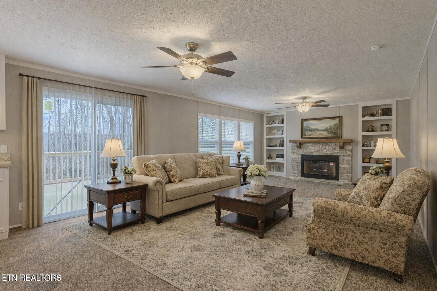 271 Charlie Newberry Road Lancing, TN 37770 - Photo 11 of 50 Cozy living room with rustic fireplace