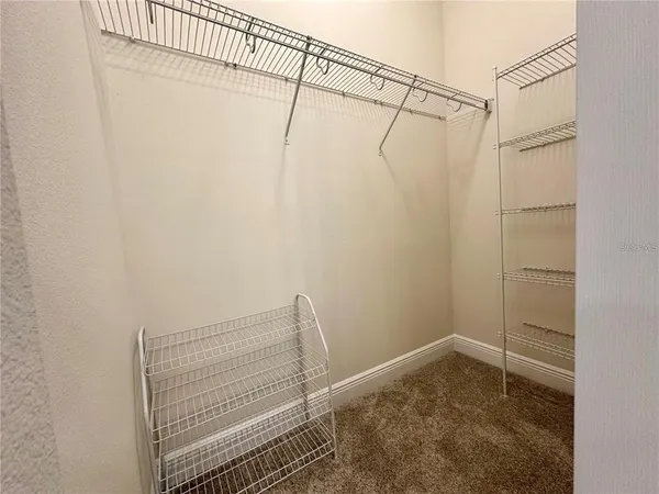 a view of a room with racks on the wall