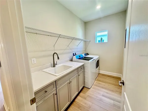 a spacious bathroom with a sink and a mirror