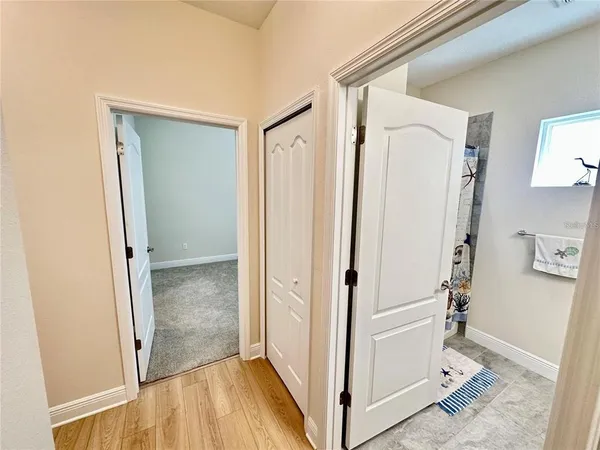 a view of front door with wooden floor