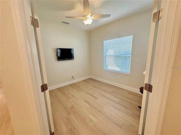 a view of an empty room with a window