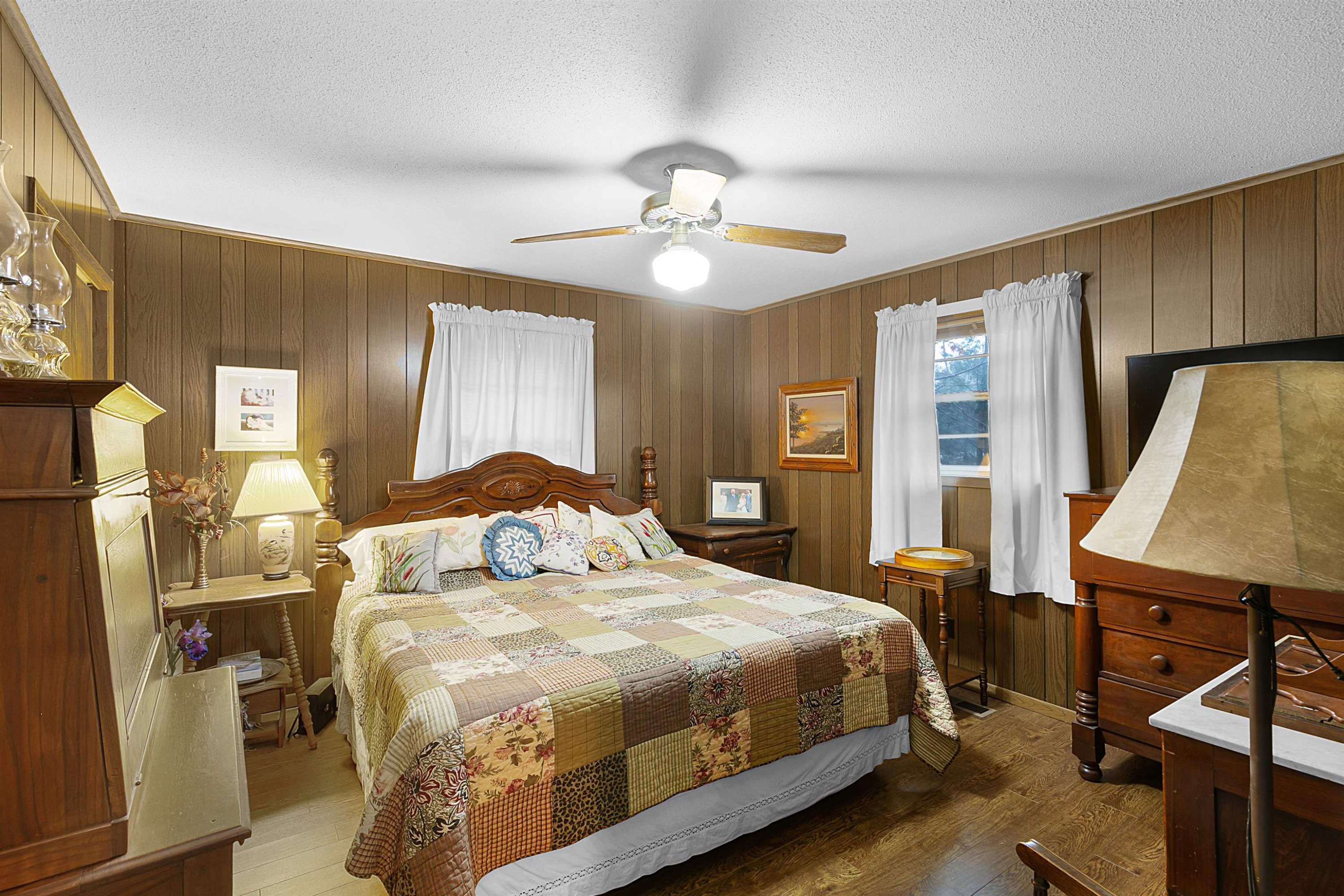 121 Odell Road Jackson, TN 38301 - Photo 8 of 18 a bedroom with a bed and a chandelier