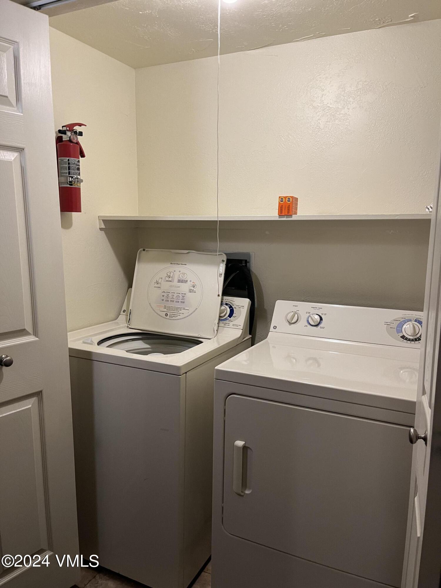 1020 Vail View Drive, Unit 331215 & 14 Vail, CO 81657 - Photo 6 of 19 a utility room with dryer and washer