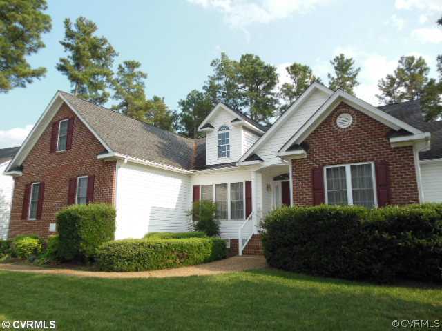 811 Club Ridge Terrace Chester, VA 23836 - Photo 21 of 21 a front view of a house with a garden