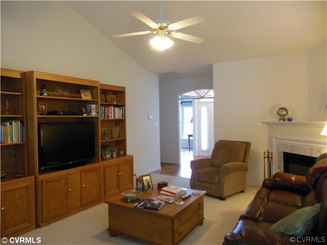 811 Club Ridge Terrace Chester, VA 23836 - Photo 4 of 21 a living room with furniture and a fireplace