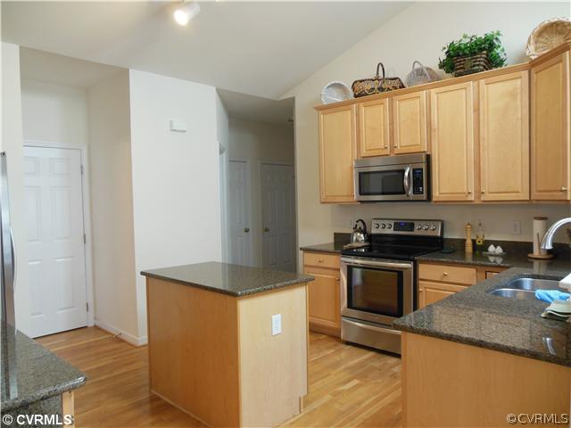 811 Club Ridge Terrace Chester, VA 23836 - Photo 7 of 21 a kitchen with stainless steel appliances granite countertop a stove a sink and a microwave