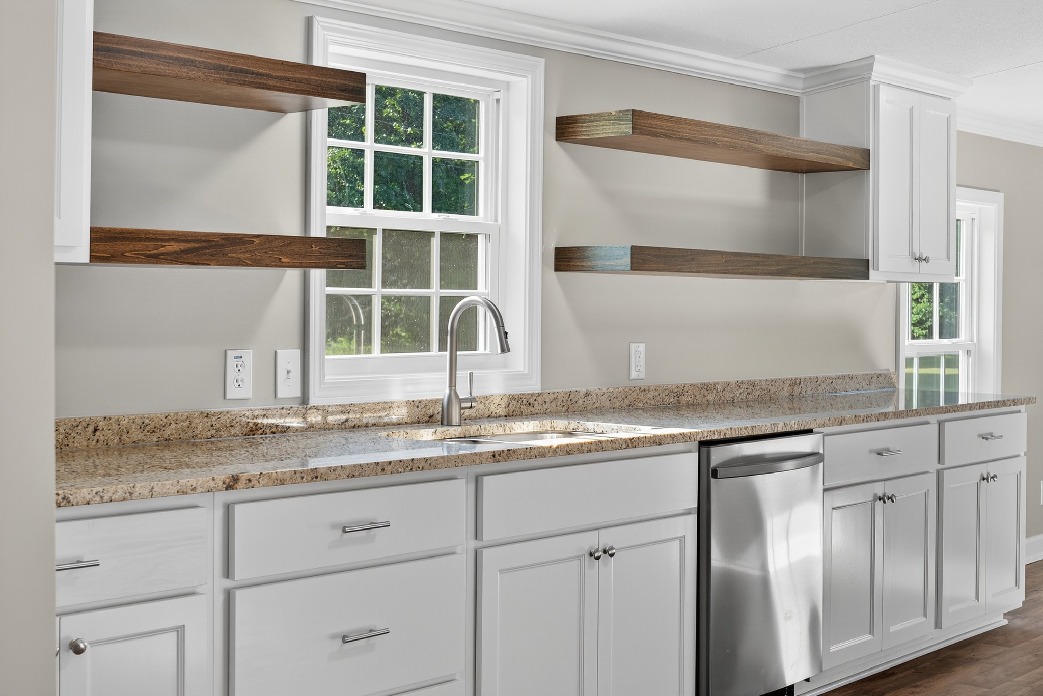 4675 Wills Road Cross Plains, TN 37049 - Photo 11 of 69 a kitchen with granite countertop stainless steel appliances white cabinets and a window
