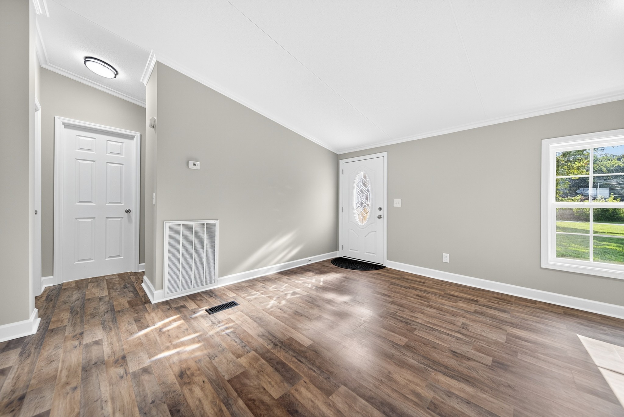 4675 Wills Road Cross Plains, TN 37049 - Photo 15 of 69 a view of empty room with wooden floor and window