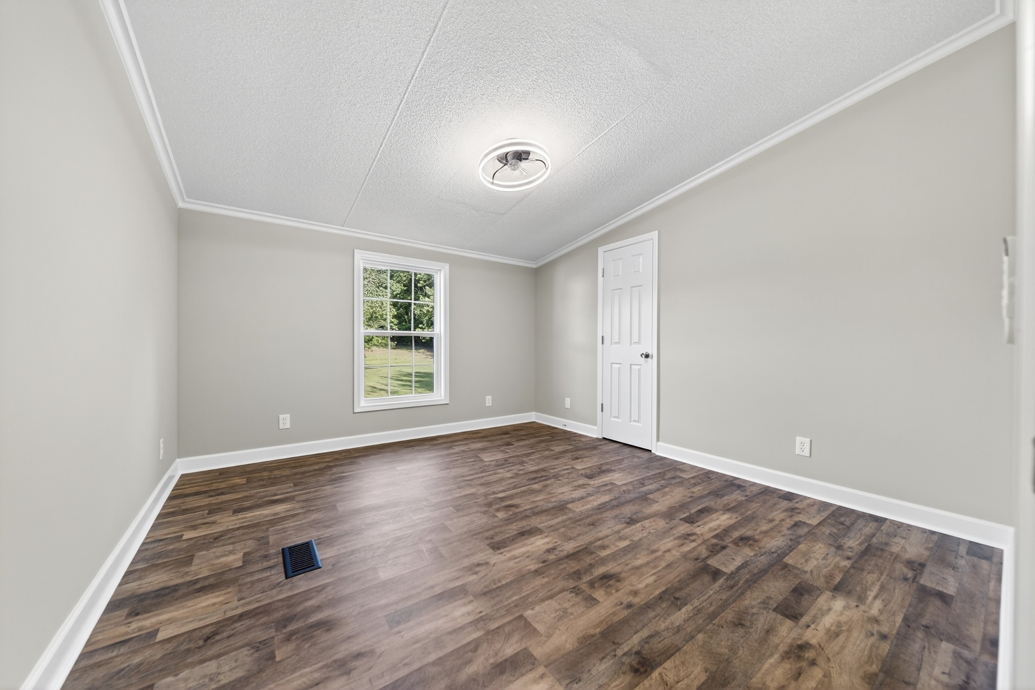 4675 Wills Road Cross Plains, TN 37049 - Photo 23 of 69 a view of an empty room with wooden floor and a window