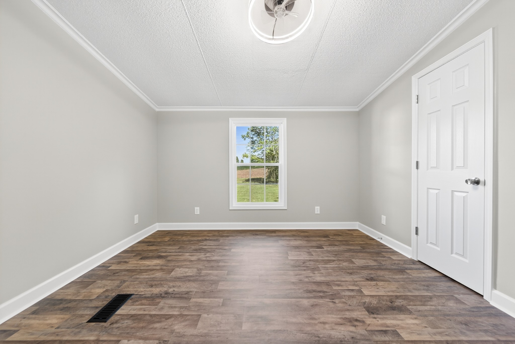 4675 Wills Road Cross Plains, TN 37049 - Photo 24 of 69 a view of empty room with wooden floor and fan