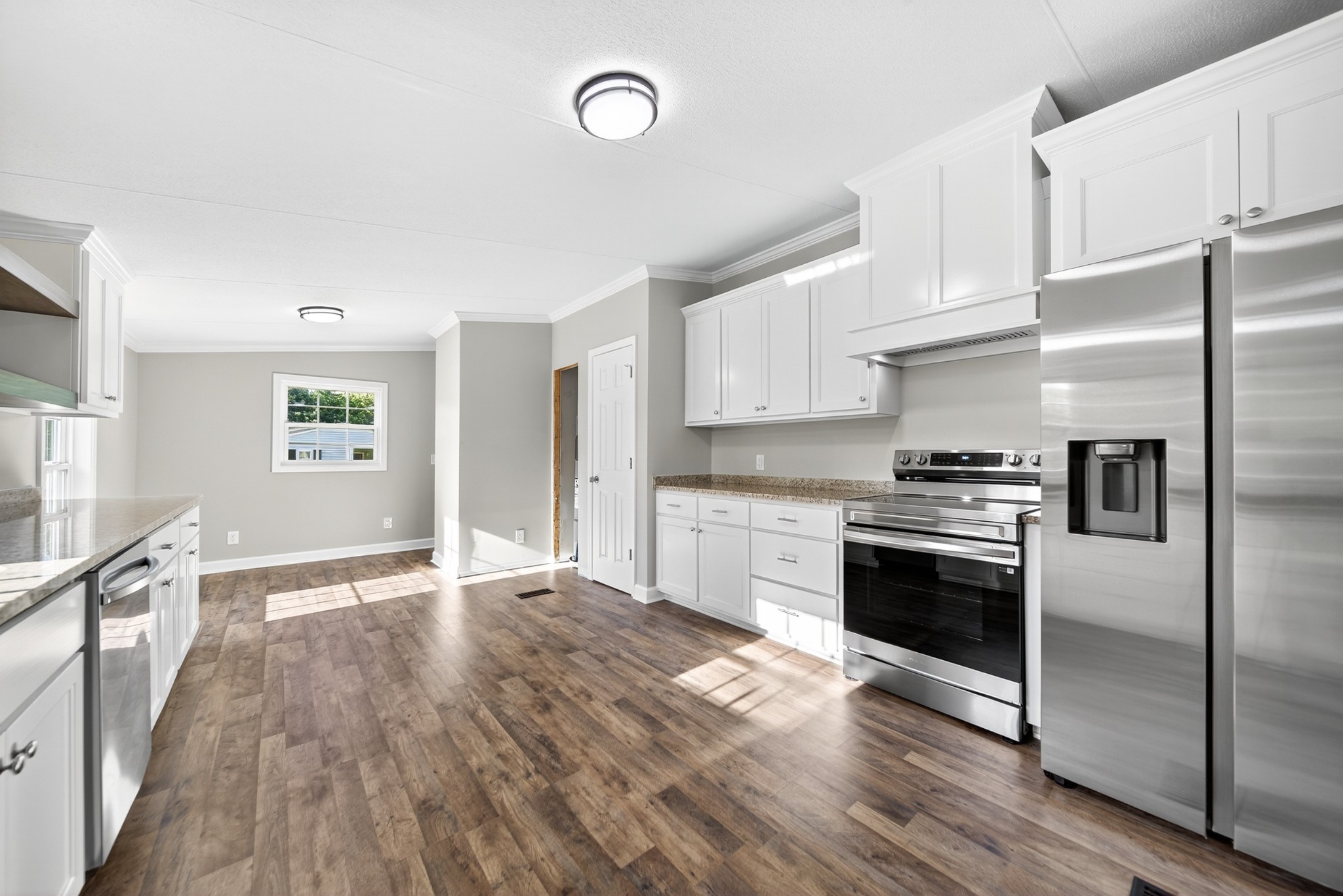 4675 Wills Road Cross Plains, TN 37049 - Photo 31 of 69 a kitchen with granite countertop a refrigerator and a stove