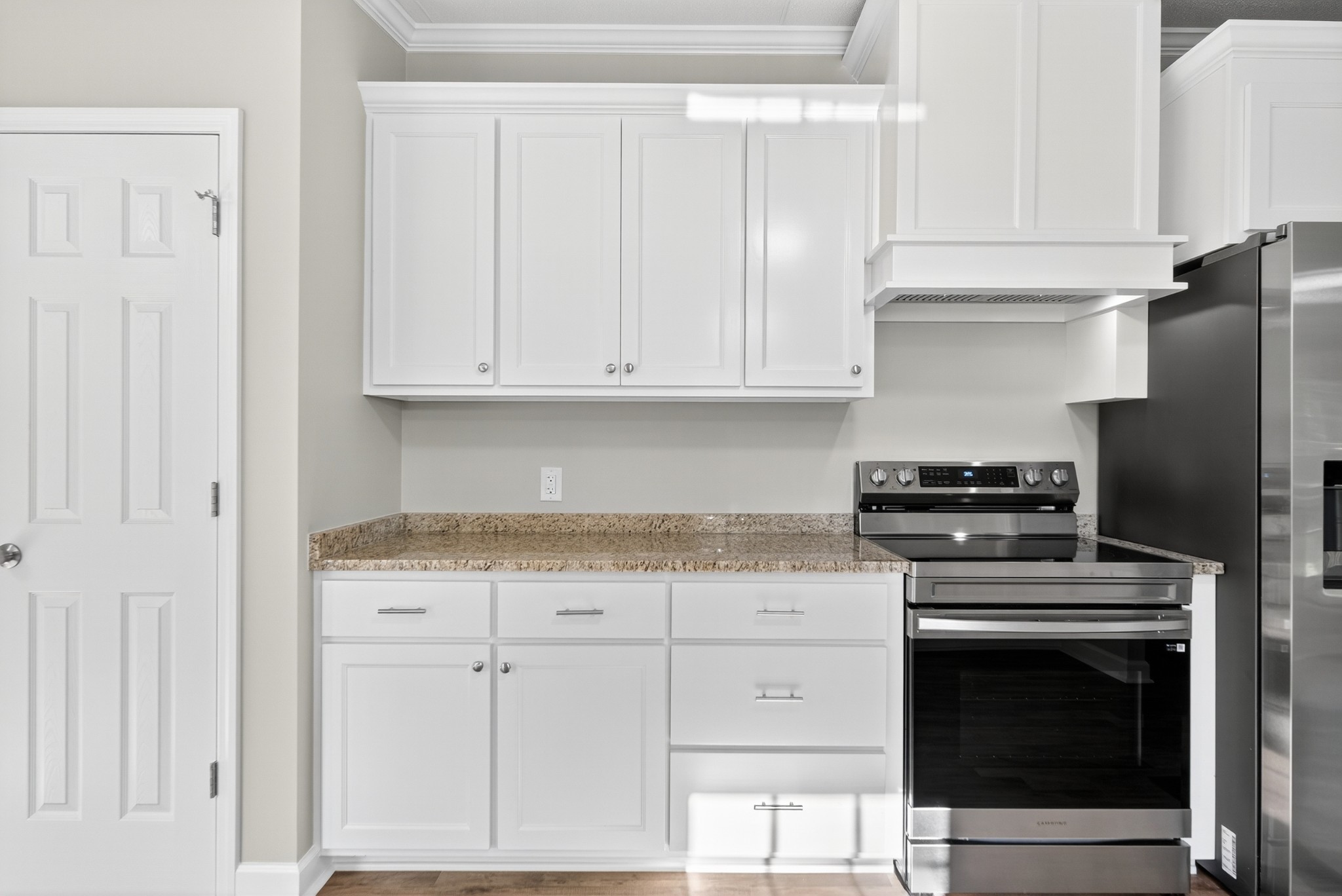 4675 Wills Road Cross Plains, TN 37049 - Photo 32 of 69 a kitchen with granite countertop white cabinets and stainless steel appliances