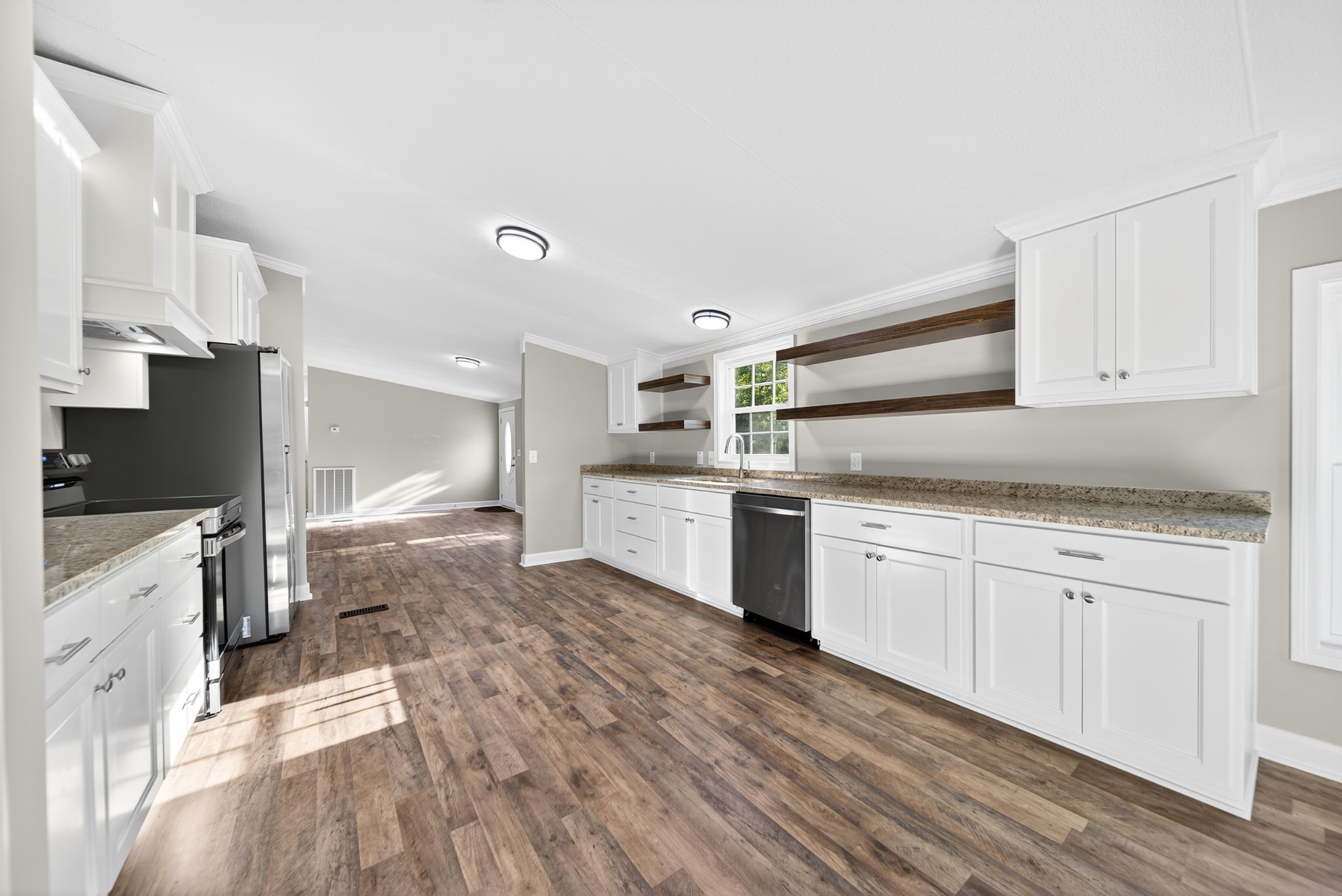 4675 Wills Road Cross Plains, TN 37049 - Photo 36 of 69 a kitchen with granite countertop a sink cabinets stainless steel appliances and a counter space