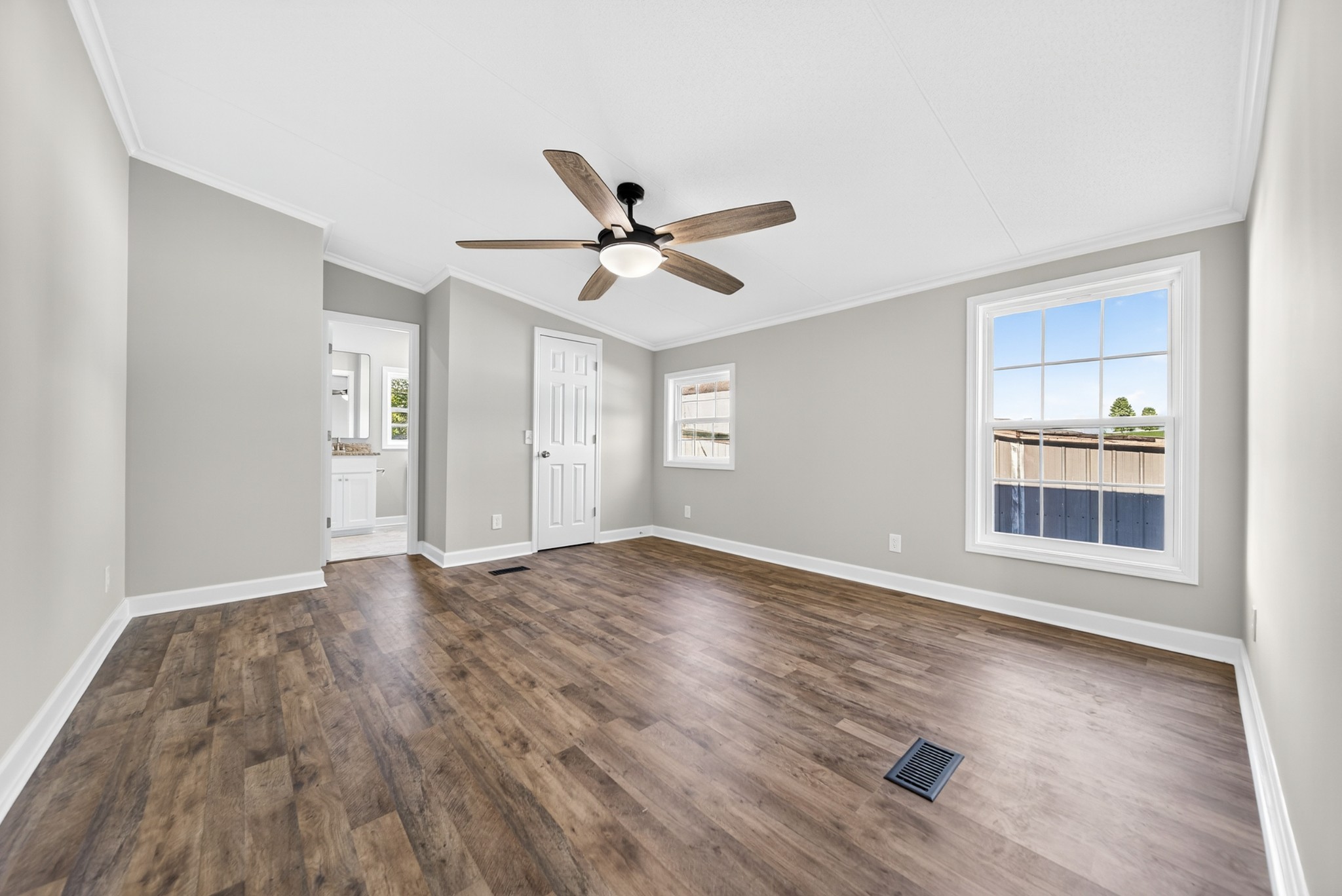 4675 Wills Road Cross Plains, TN 37049 - Photo 37 of 69 a view of empty room with wooden floor and fan