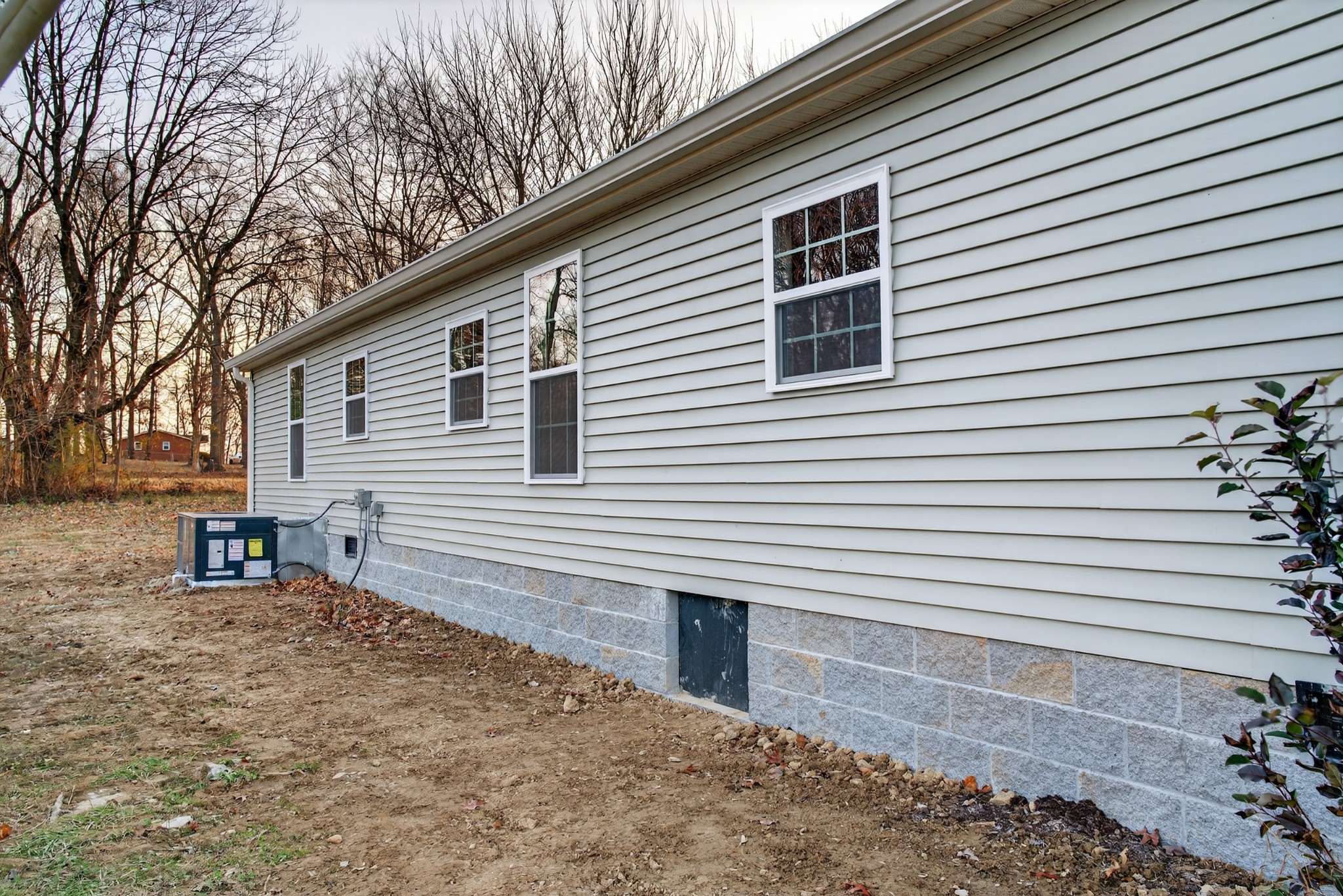4675 Wills Road Cross Plains, TN 37049 - Photo 47 of 69 a backyard of a house with table and chairs
