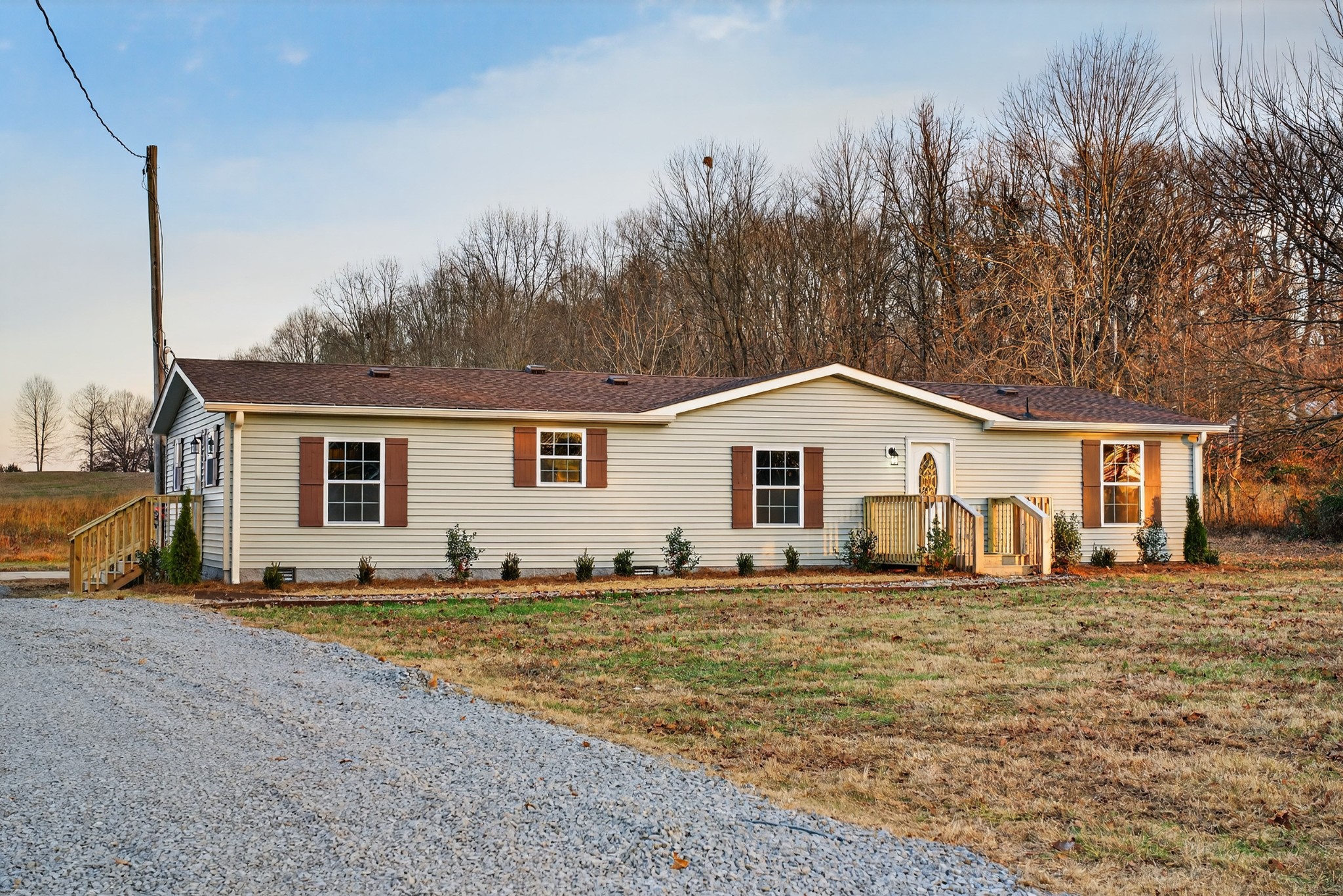 4675 Wills Road Cross Plains, TN 37049 - Photo 50 of 69 a big house with a big yard and large trees