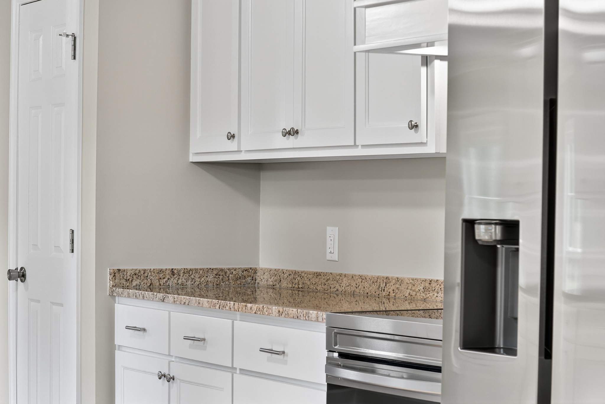 4675 Wills Road Cross Plains, TN 37049 - Photo 10 of 69 a kitchen with granite countertop white cabinets and stainless steel appliances