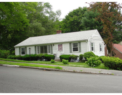 47 Ridge Street Arlington, MA 02474 - Photo 1 of 1 a front view of a house with a yard and potted plants