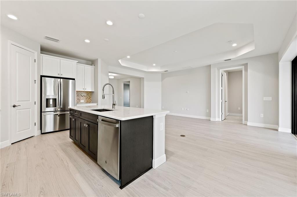 3952 Pegasus Way Naples, FL 34120 - Photo 20 of 50 a kitchen with a sink and stainless steel appliances