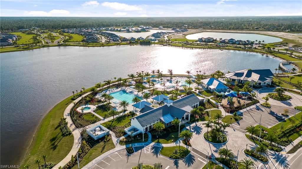 3952 Pegasus Way Naples, FL 34120 - Photo 2 of 50 an aerial view of a house with a lake view