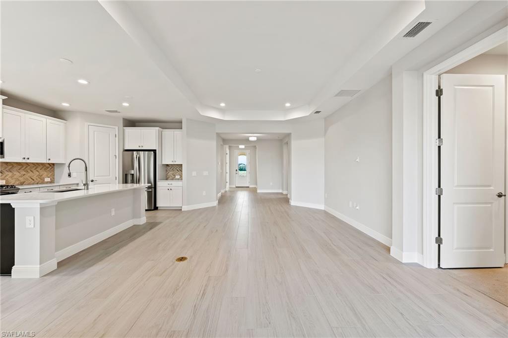 3952 Pegasus Way Naples, FL 34120 - Photo 21 of 50 a view of kitchen with wooden floor