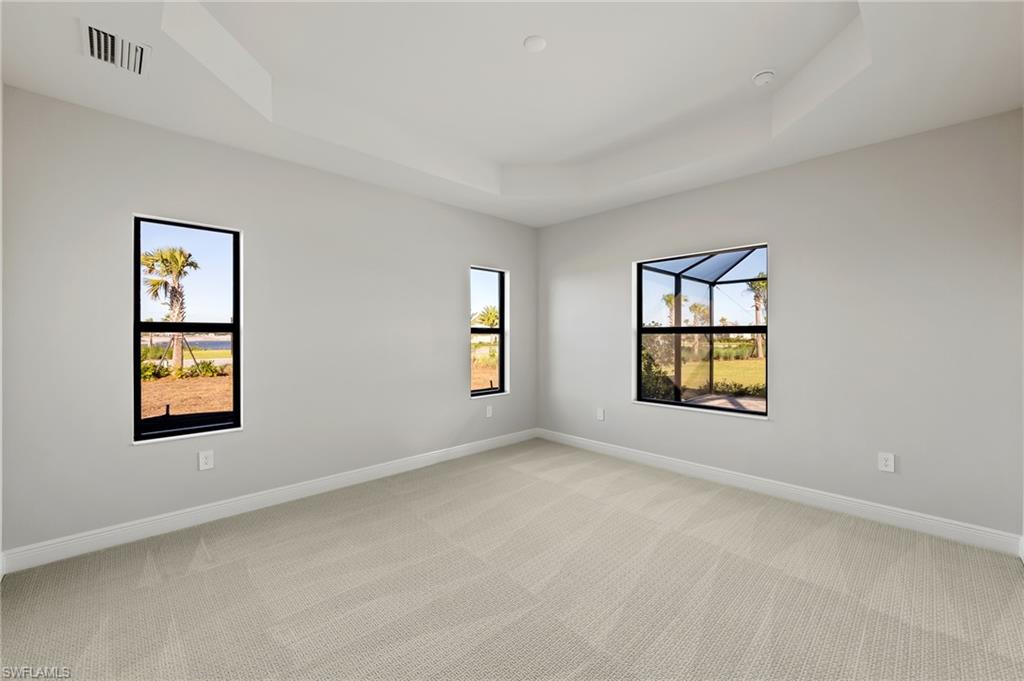 3952 Pegasus Way Naples, FL 34120 - Photo 22 of 50 an empty room with windows