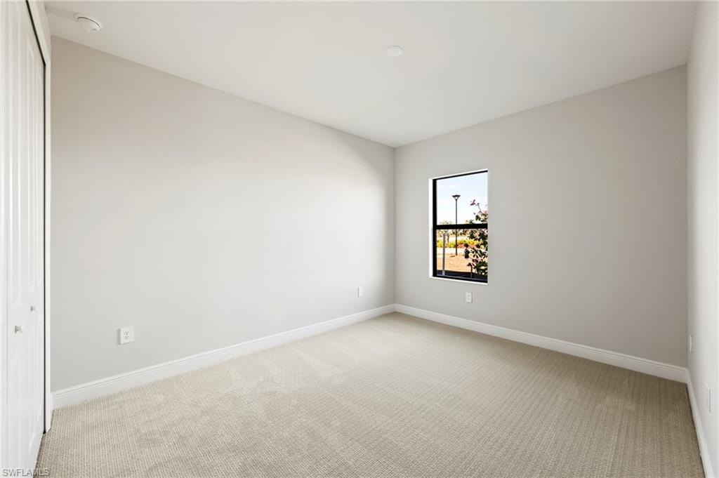 3952 Pegasus Way Naples, FL 34120 - Photo 31 of 50 an empty room with a window
