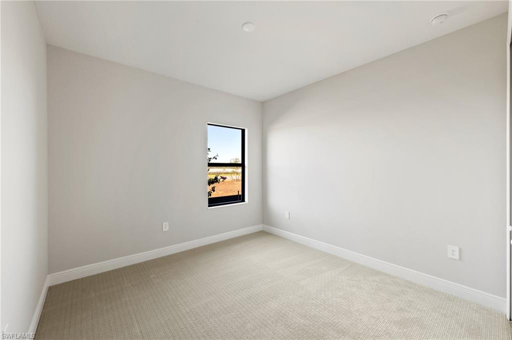 3952 Pegasus Way Naples, FL 34120 - Photo 34 of 50 an empty room with a window