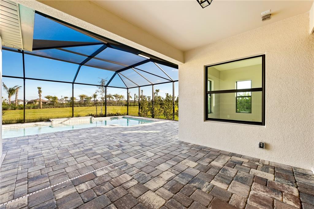 3952 Pegasus Way Naples, FL 34120 - Photo 37 of 50 a view of an empty room with a window