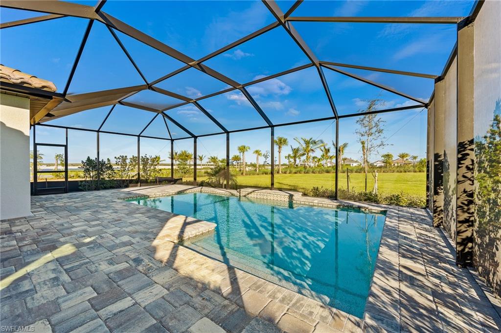 3952 Pegasus Way Naples, FL 34120 - Photo 38 of 50 a view of a swimming pool with a patio