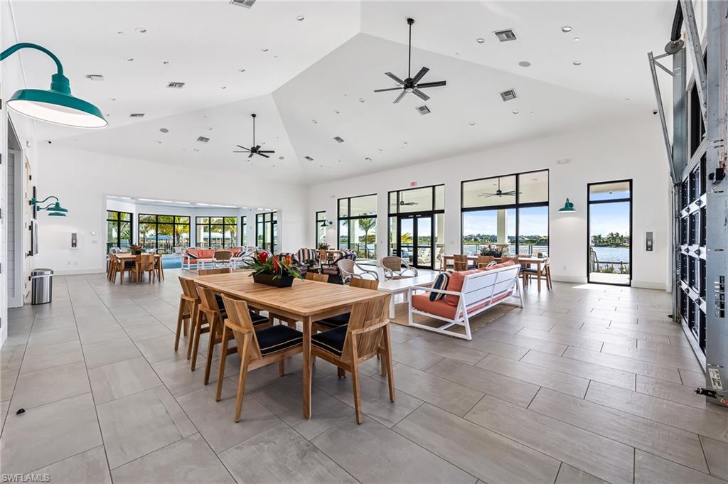 3952 Pegasus Way Naples, FL 34120 - Photo 44 of 50 a outdoor space with lots of tables a chandelier and pool table