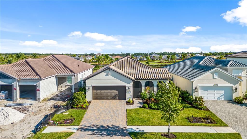 3952 Pegasus Way Naples, FL 34120 - Photo 48 of 50 front view of a house with a yard