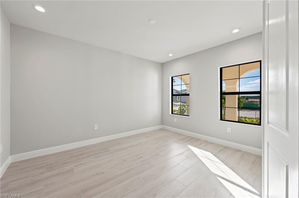 3952 Pegasus Way Naples, FL 34120 - Photo 8 of 50 an empty room with windows