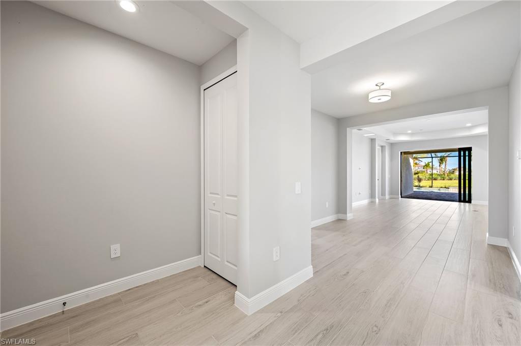 3952 Pegasus Way Naples, FL 34120 - Photo 9 of 50 a view of empty room with window and wooden floor