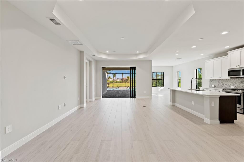 3952 Pegasus Way Naples, FL 34120 - Photo 10 of 50 a view of kitchen with furniture and window