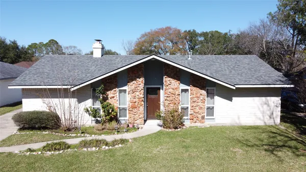 a view of house with yard