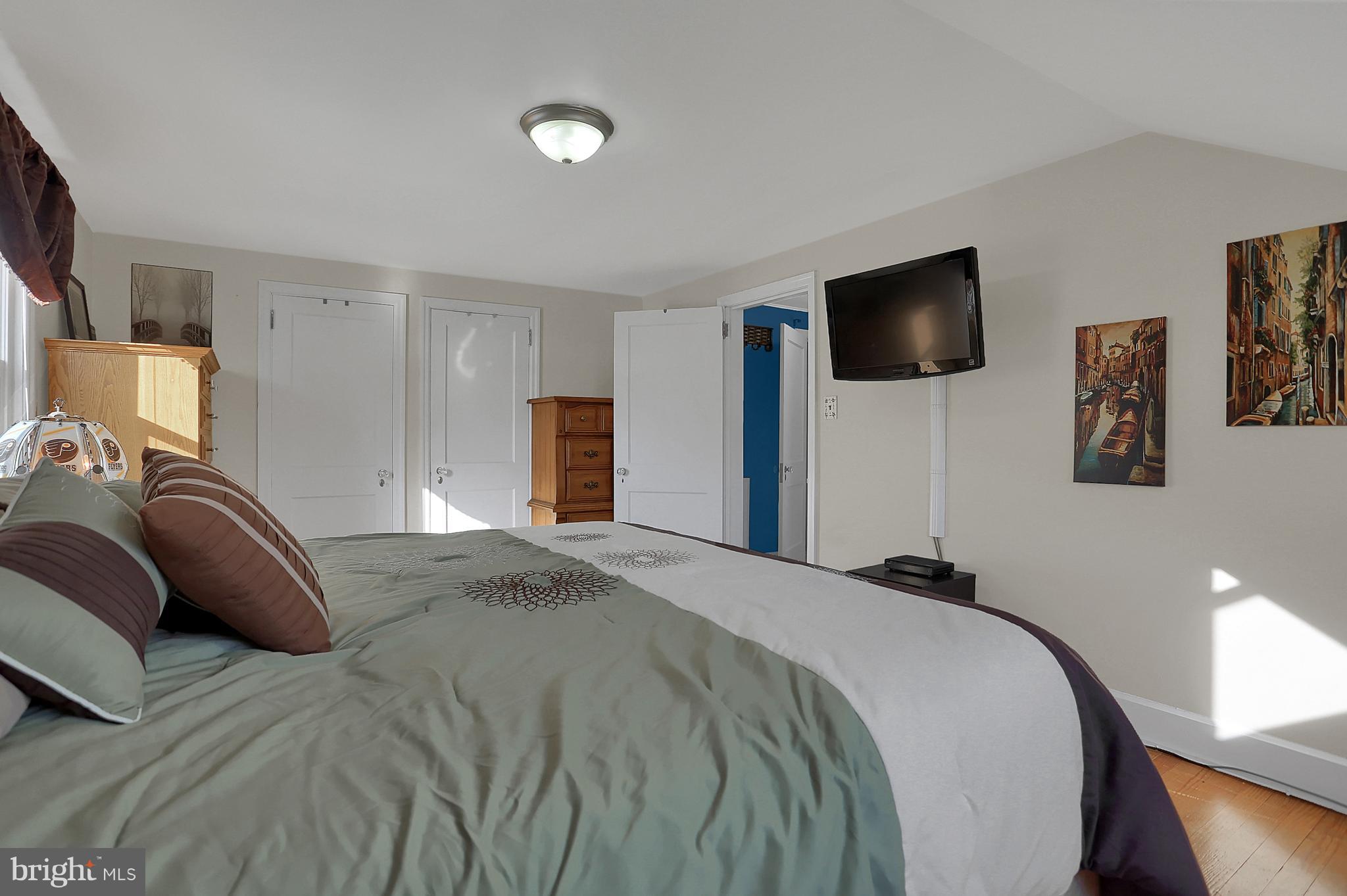2380 Derry Road York, PA 17408 - Photo 16 of 34 a bedroom with a large bed and a flat screen tv