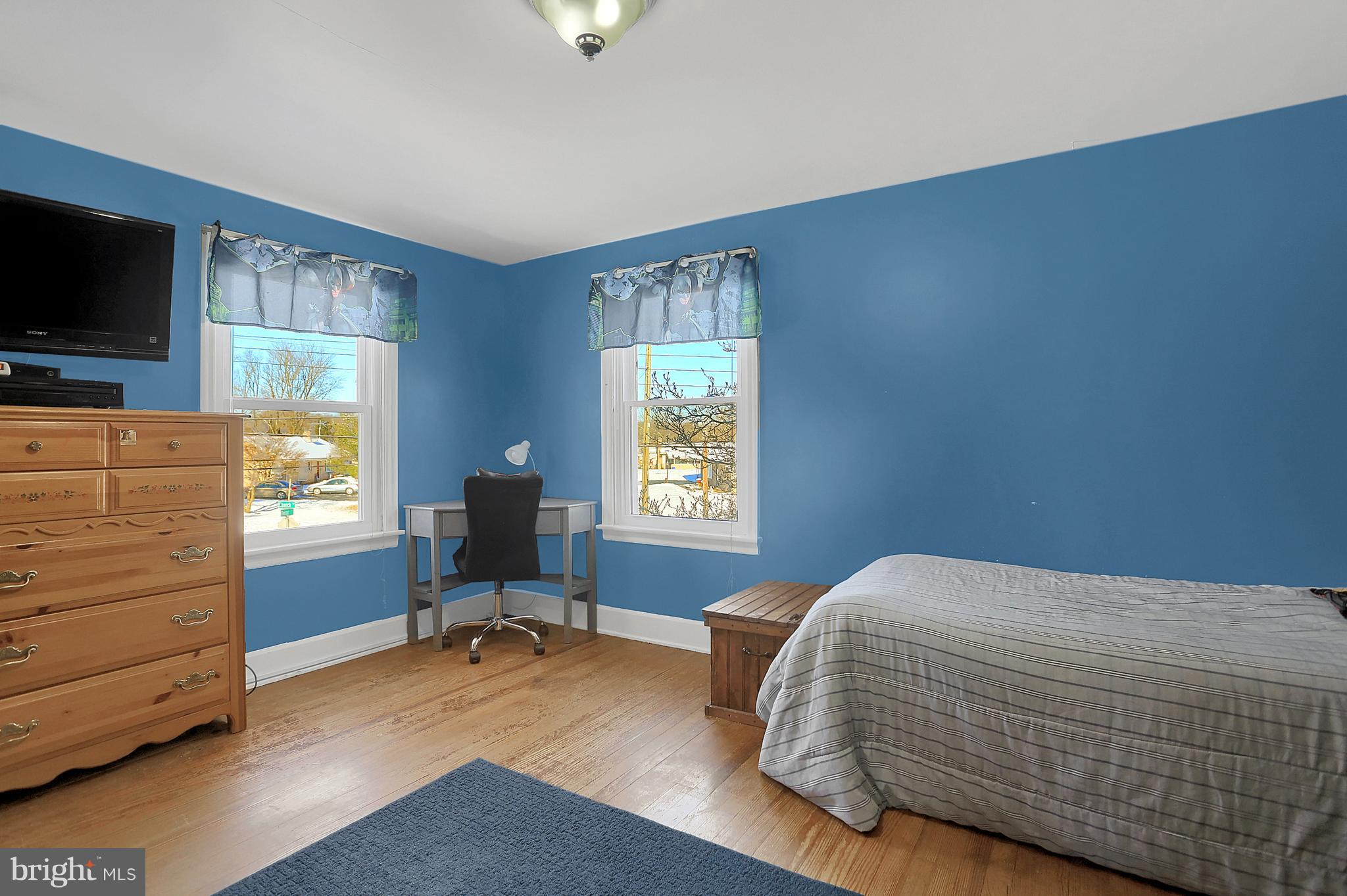 2380 Derry Road York, PA 17408 - Photo 19 of 34 a bedroom with a bed and flat screen tv