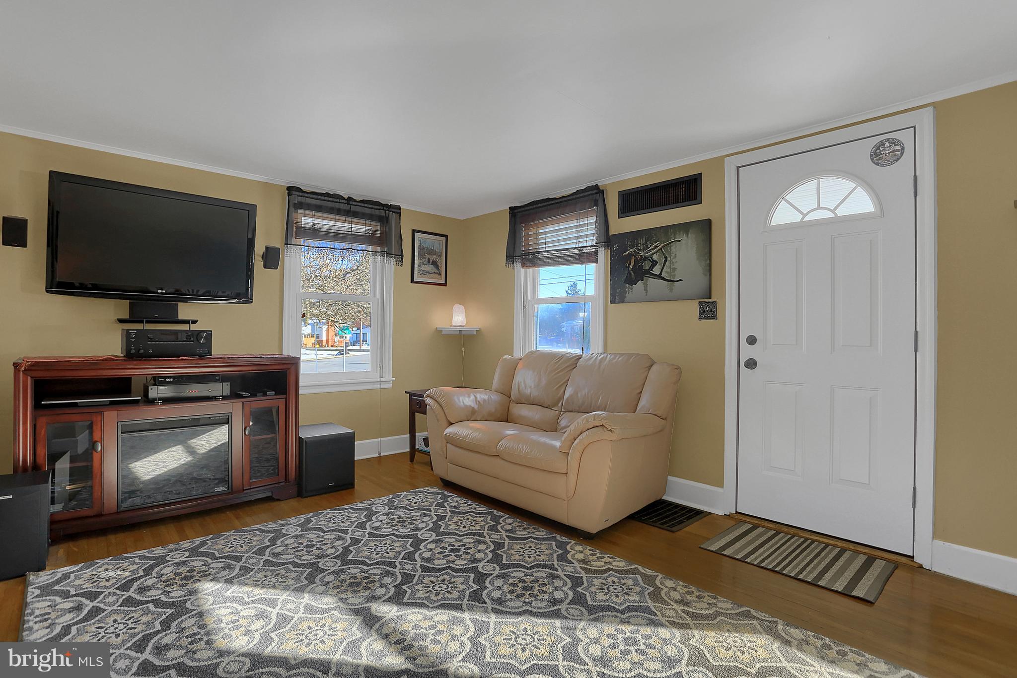 2380 Derry Road York, PA 17408 - Photo 3 of 34 a living room with furniture and a flat screen tv