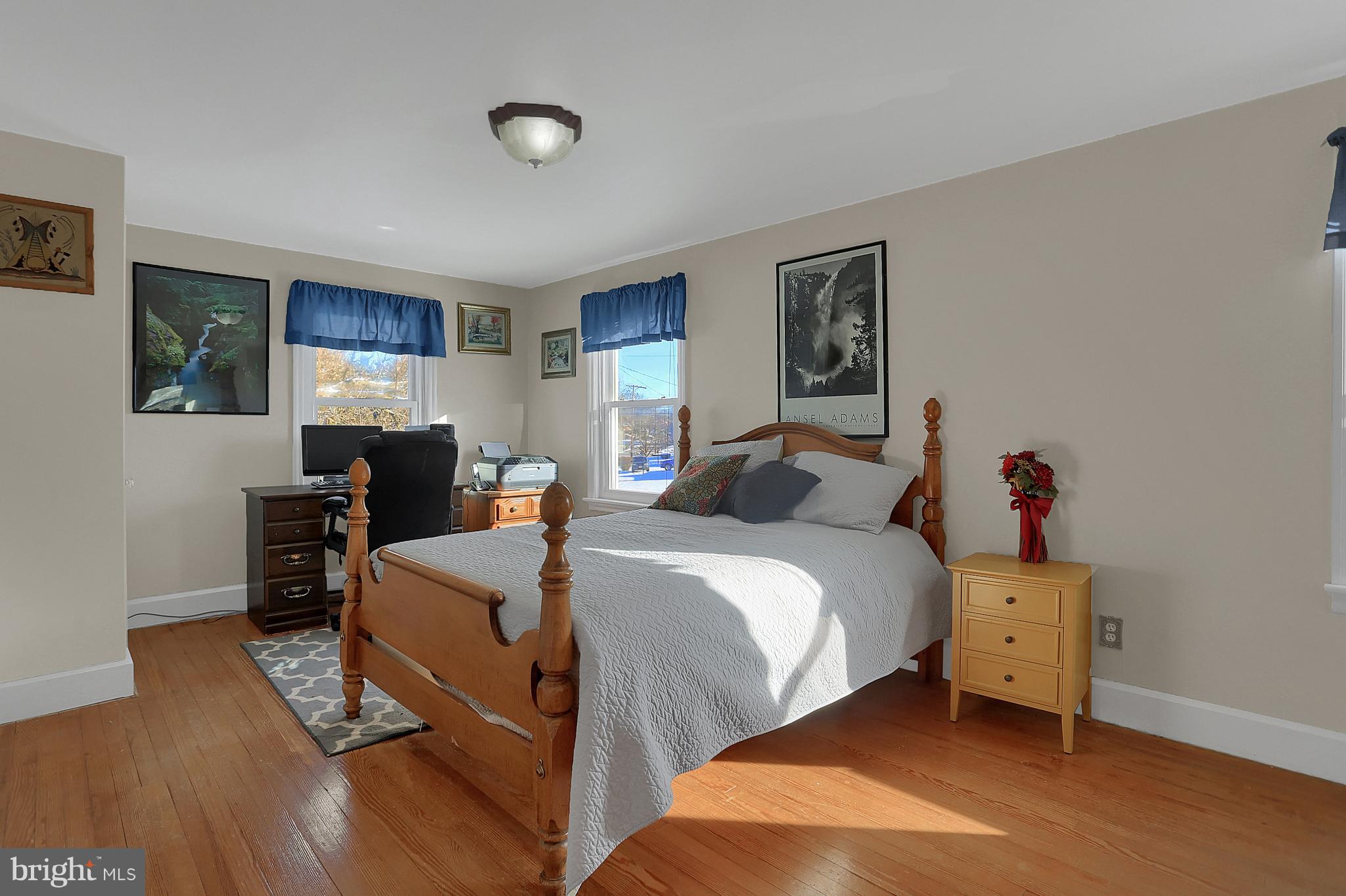 2380 Derry Road York, PA 17408 - Photo 22 of 34 a bedroom with a bed and wooden floor