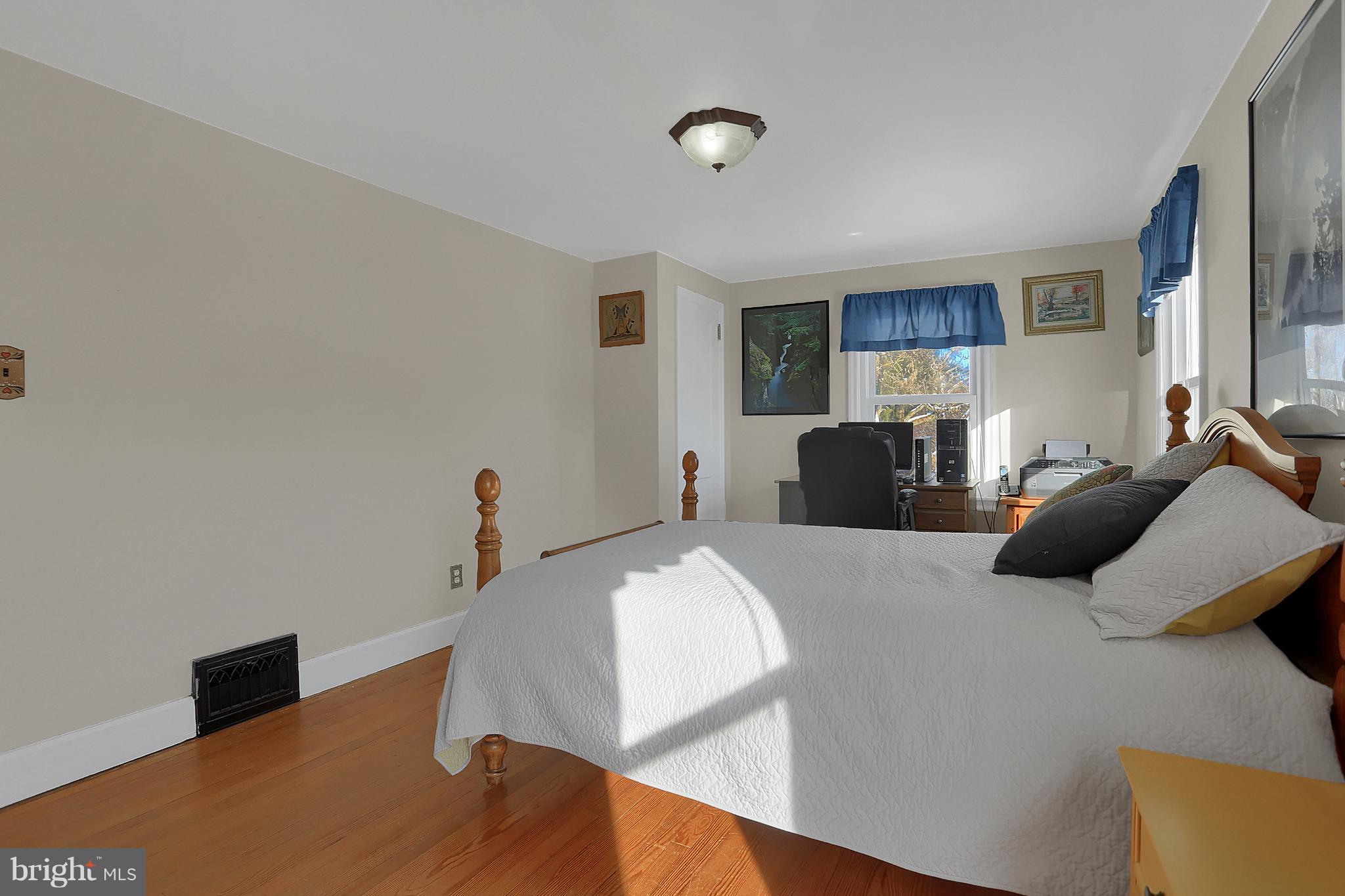 2380 Derry Road York, PA 17408 - Photo 23 of 34 a bedroom with a bed and a flat screen tv