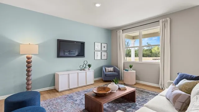 a living room with furniture and window