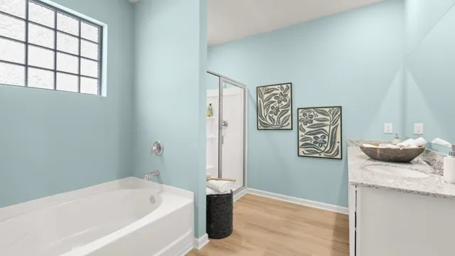 a bathroom with a bathtub and shower